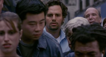 Movie still from “Margaret” (2011), directed by Kenneth Lonergan – A group of men standing around each other in the street; Close Up shot, Over the shoulder angle