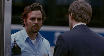 Movie still from “Margaret” (2011), directed by Kenneth Lonergan – Two men in business suits talking to each other; Close Up shot, Over the shoulder angle