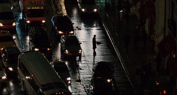 Movie still from “Margaret” (2011), directed by Kenneth Lonergan – A man standing on the side of a road at night; Extreme Wide shot, High angle