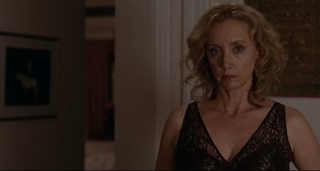 Movie still from “Margaret” (2011), directed by Kenneth Lonergan – A woman standing in a room wearing a black dress; Close Up shot, Over the shoulder angle
