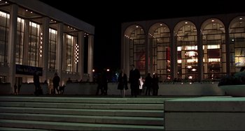 Movie still from “Margaret” (2011), directed by Kenneth Lonergan – A group of people walking in front of a building at night; Extreme Wide shot, Low angle