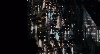 Movie still from “Margaret” (2011), directed by Kenneth Lonergan – A bunch of cars that are in the street at night; Extreme Wide shot, High angle