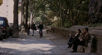 Movie still from “Margaret” (2011), directed by Kenneth Lonergan – A group of people riding bikes down a street; Wide shot, High angle