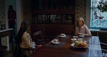 Movie still from “Margaret” (2011), directed by Kenneth Lonergan – Two women sitting at a table with cups of coffee; Medium shot, High angle