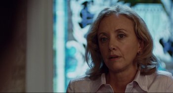 Movie still from “Margaret” (2011), directed by Kenneth Lonergan – An older woman is looking into the distance; Close Up shot, Over the shoulder angle