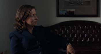 Movie still from “Margaret” (2011), directed by Kenneth Lonergan – A woman sitting on a couch in a living room; Medium shot, Over the shoulder angle