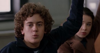 Movie still from “Margaret” (2011), directed by Kenneth Lonergan – A person with curly brown hair; Close Up shot, Low angle