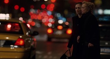 Movie still from “Margaret” (2011), directed by Kenneth Lonergan – Two women walking down a street at night; Medium shot, Over the shoulder angle
