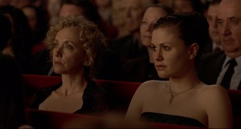 Movie still from “Margaret” (2011), directed by Kenneth Lonergan – Two women are sitting in the audience at a theater; Medium shot, High angle