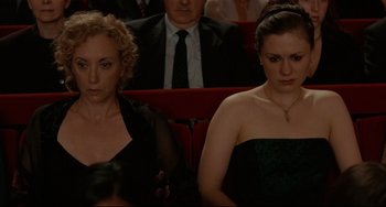 Movie still from “Margaret” (2011), directed by Kenneth Lonergan – Two women sitting next to each other in a theater; Medium shot, High angle