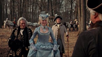 Movie still from “Marie Antoinette” (2006), directed by Sofia Coppola – A group of people dressed in period costumes; Medium shot, Low angle