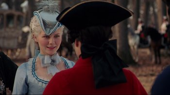 Movie still from “Marie Antoinette” (2006), directed by Sofia Coppola – A man and a woman dressed in period clothing; Close Up shot, Over the shoulder angle