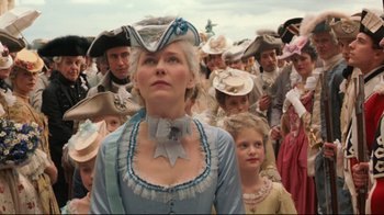 Movie still from “Marie Antoinette” (2006), directed by Sofia Coppola – A crowd of people in period costumes and hats; Medium shot, Low angle