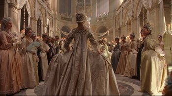 Movie still from “Marie Antoinette” (2006), directed by Sofia Coppola – A group of people gathered in a large room; Wide shot, Over the shoulder angle