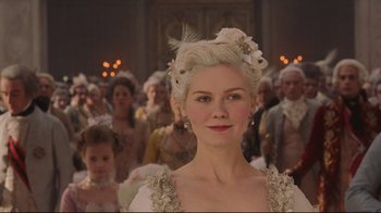 Movie still from “Marie Antoinette” (2006), directed by Sofia Coppola – A group of people that are standing in a room together; Close Up shot, Over the shoulder angle