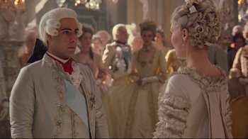 Movie still from “Marie Antoinette” (2006), directed by Sofia Coppola – A man and a woman dressed in period clothing; Medium shot, Over the shoulder angle