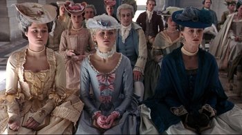 Movie still from “Marie Antoinette” (2006), directed by Sofia Coppola – A group of people dressed in period clothing; Medium shot, High angle