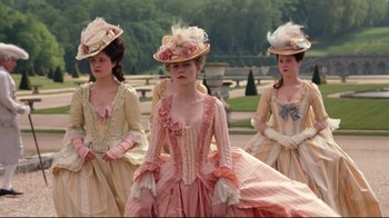 Movie still from “Marie Antoinette” (2006), directed by Sofia Coppola – A group of women in period dress standing next to each other; Medium shot, Low angle