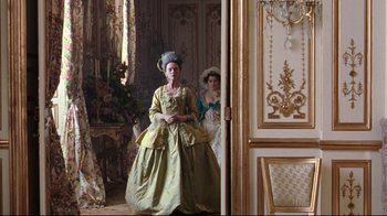 Movie still from “Marie Antoinette” (2006), directed by Sofia Coppola – Two women dressed in period costumes in a room; Wide shot, Low angle