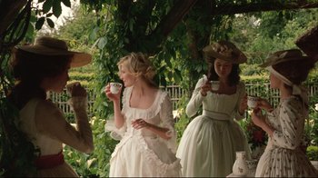 Movie still from “Marie Antoinette” (2006), directed by Sofia Coppola – Two women dressed in period clothing are drinking tea; Medium shot, Low angle