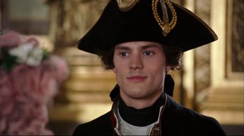 Movie still from “Marie Antoinette” (2006), directed by Sofia Coppola – A young man in a pirate's hat and black jacket; Close Up shot, Over the shoulder angle