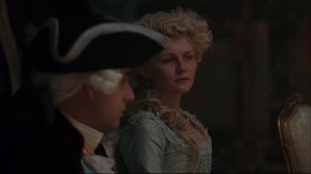 Movie still from “Marie Antoinette” (2006), directed by Sofia Coppola – A man and a woman dressed in period clothing; Close Up shot, Over the shoulder angle