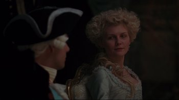 Movie still from “Marie Antoinette” (2006), directed by Sofia Coppola – A man and a woman dressed in period clothing; Close Up shot, Over the shoulder angle