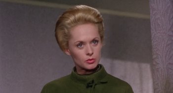 Movie still from “Marnie” (1964), directed by Alfred Hitchcock – A person wearing a green jacket; Close Up shot, Low angle