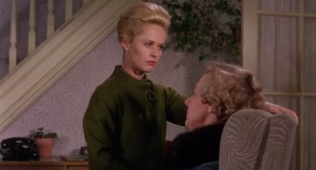 Movie still from “Marnie” (1964), directed by Alfred Hitchcock – A woman in a green sweater looking at another woman in a green sweater; Medium shot, Over the shoulder angle