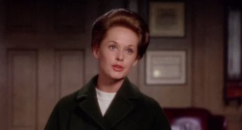 Movie still from “Marnie” (1964), directed by Alfred Hitchcock – A person wearing a coat; Close Up shot, Over the shoulder angle