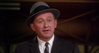 Movie still from “Marnie” (1964), directed by Alfred Hitchcock – An older man in a suit and a hat; Close Up shot, Low angle