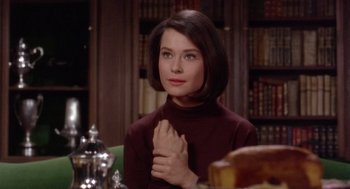 Movie still from “Marnie” (1964), directed by Alfred Hitchcock – A woman sitting in front of a table with a cake; Close Up shot, Over the shoulder angle