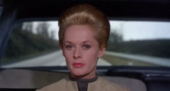Movie still from “Marnie” (1964), directed by Alfred Hitchcock – An image of a woman in a car; Close Up shot, Low angle
