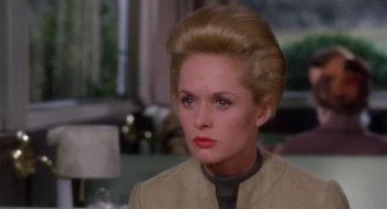 Movie still from “Marnie” (1964), directed by Alfred Hitchcock – A woman that is wearing a jacket; Close Up shot, Over the shoulder angle