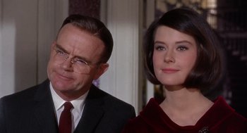 Movie still from “Marnie” (1964), directed by Alfred Hitchcock – A man and a woman standing next to each other; Close Up shot, Over the shoulder angle