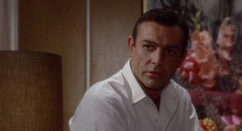 Movie still from “Marnie” (1964), directed by Alfred Hitchcock – A person wearing a white shirt; Close Up shot, Over the shoulder angle