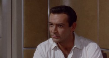 Movie still from “Marnie” (1964), directed by Alfred Hitchcock – A person wearing a white shirt; Close Up shot, High angle