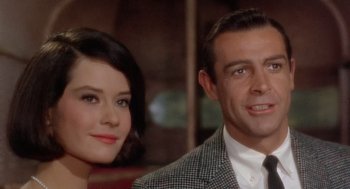 Movie still from “Marnie” (1964), directed by Alfred Hitchcock – A man and a woman pose for a picture; Close Up shot, Over the shoulder angle