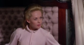 Movie still from “Marnie” (1964), directed by Alfred Hitchcock – A woman sitting on top of a couch in a room; Close Up shot, High angle