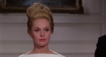 Movie still from “Marnie” (1964), directed by Alfred Hitchcock – A person wearing a dress; Close Up shot, Low angle