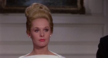 Movie still from “Marnie” (1964), directed by Alfred Hitchcock – A person wearing a white dress; Close Up shot, Over the shoulder angle