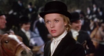 Movie still from “Marnie” (1964), directed by Alfred Hitchcock – A person wearing a suit and a hat; Close Up shot, Over the shoulder angle