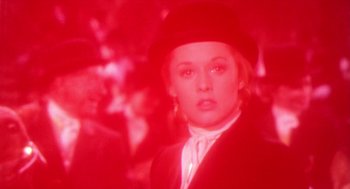 Movie still from “Marnie” (1964), directed by Alfred Hitchcock – A woman wearing a black hat and a white shirt; Close Up shot, Over the shoulder angle