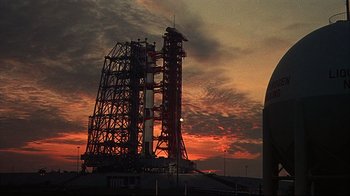 Movie still from “Marooned” (1969), directed by John Sturges – A red and white rocket in front of a red sky; Extreme Wide shot, Low angle
