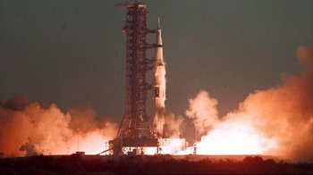 Movie still from “Marooned” (1969), directed by John Sturges – A rocket is being launched into the night sky; Extreme Wide shot, Low angle