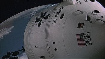 Movie still from “Marooned” (1969), directed by John Sturges – View of the side of a space ship; Extreme Wide shot, Overhead angle