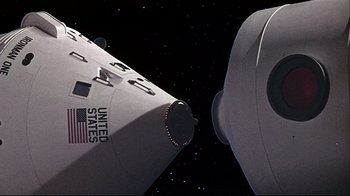 Movie still from “Marooned” (1969), directed by John Sturges – View of the side of a space ship; Extreme Wide shot, Overhead angle