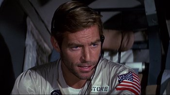 Movie still from “Marooned” (1969), directed by John Sturges – A person wearing a headset; Close Up shot, Low angle