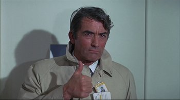 Movie still from “Marooned” (1969), directed by John Sturges – A man giving a thumbs up while wearing a jacket; Close Up shot, Low angle