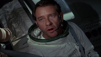 Movie still from “Marooned” (1969), directed by John Sturges – A person wearing a space suit; Close Up shot, Low angle